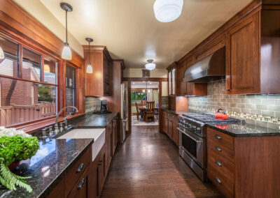 interior view of a beautiful large kitchen with granite countertops and wood floors in Salt Lake City