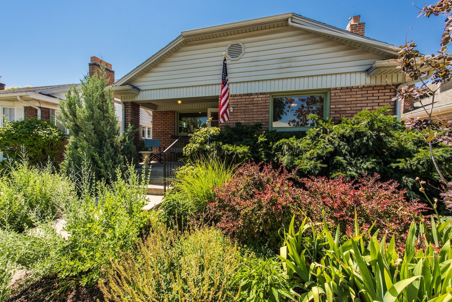 slc-homes-secondary-water-utah-home-landscaping Salt Lake City home with landscaped front yard and established plants